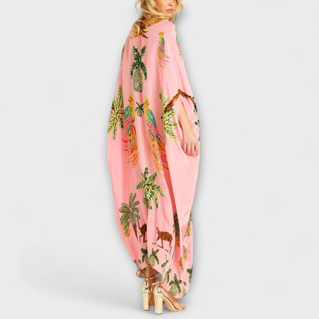 Linda - Působivé šaty s asymetrickými ramínky a potiskem kokosových palem